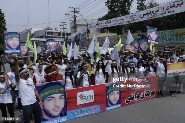 Members of a non-governmental organization 'Youth Forum for Kashmir' chant anti Indian slogans during a rally to mark 1st anniversary of the death of...