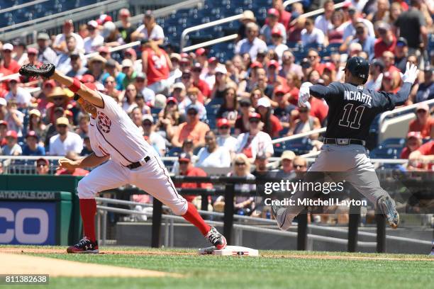 Ryan Zimmerman of the Washington Nationals catches the ball to beat Ender Inciarte of the Atlanta Braves at first during a baseball game at Nationals...