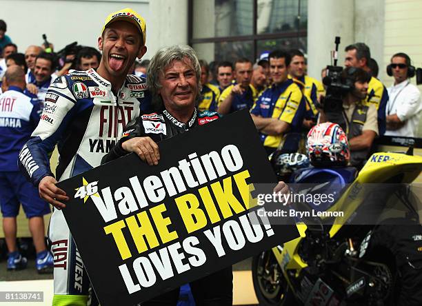 Valentino Rossi of Italy and the Fiat Yamaha Team celebrates equalling the race win record of Angel Nieto at the MotoGP of France at the Le Mans...