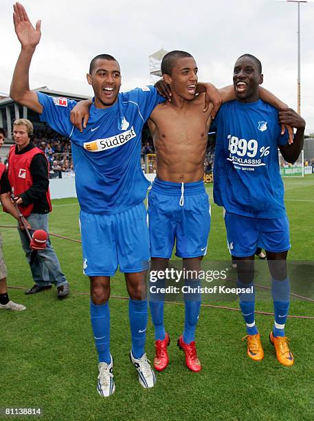 Marvin Compper, Luiz Gustavo and Demba Ba of Hoffenheim celebrate the ascension to the First Bundesliga after winning 5-0 the Second Bundesliga match...