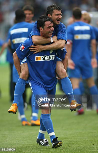 Zsolt Loew and Dragan Paljic of Hoffenheim celebrate the ascension to the First Bundesliga after winning 5-0 the Second Bundesliga match between 1899...