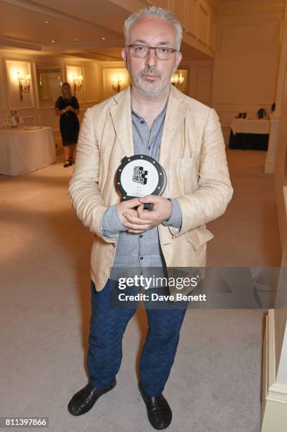 Michael Morris, winner of the Visual Art award for Artangel's "Inside: Artists And Writers In Reading Prison", poses in the winners room at The South...