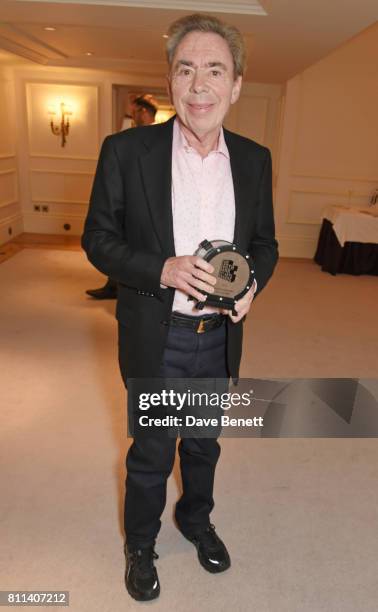 Lord Andrew Lloyd Webber, winner of the Outstanding Achievement Award, poses in the winners room at The South Bank Sky Arts Awards at The Savoy Hotel...