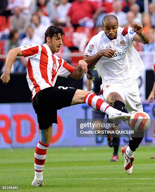 Sevilla's Kanoute vies with Athletic's Aitor Ocio during a Spanish league football match at the Sanchez Pizjuan stadium in Seville, on May...