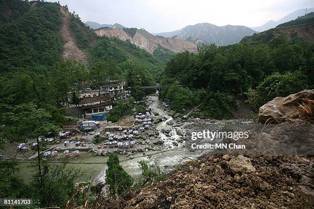 Landslides dot the mountains around a town May 18, 2008 in Dujiangyan, Sichuan province, China. A major earthquake measuring 7.9 on the Richter...