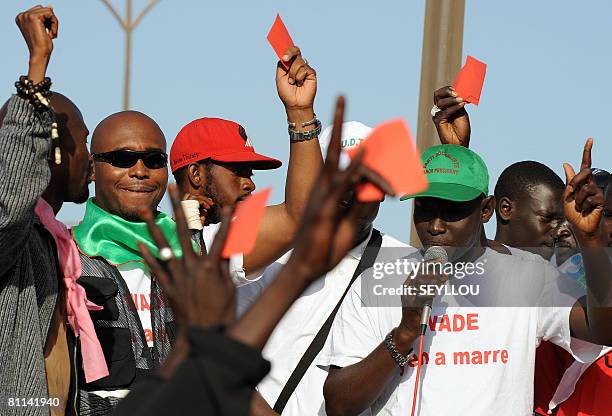 Young opposition supporters hold red cards, in reference to a soccer penalization, as they protest against contested constitutional changes, special...