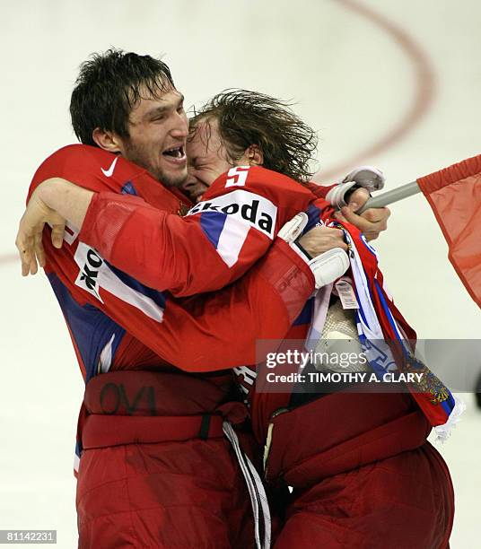 Russia's Alexander Ovechkin and Ilya Nikulin embrace after their team beats Canada 5-4 in overtime at the gold medal game of the 2008 IIHF World...