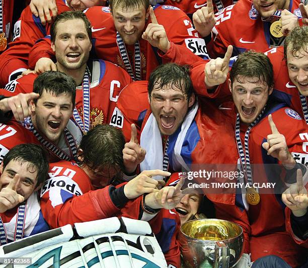 Team Russia poses with their gold medals and trophy after defeating Canada 5-4 in overtime at the gold medal game of the 2008 IIHF World Hockey...