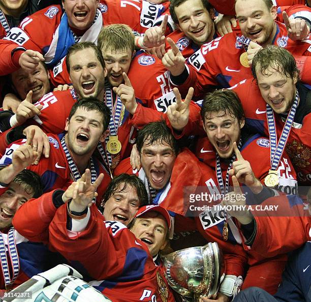 Team Russia pose with their gold medals and trophy after they beat Canada 5-4 in overtime at the gold medal game of the 2008 IIHF World Hockey...