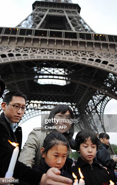 Writer Anh-Dao Traxel , foster daughter of French former President Jacques Chirac, takes part in ceremony under Eiffel Tower in Paris on May 18, 2008...