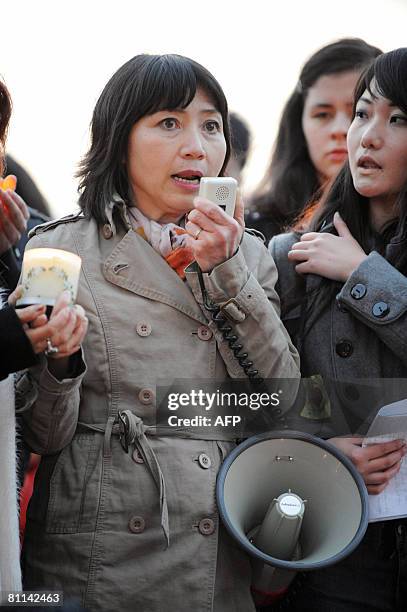 Writer Anh-Dao Traxel , foster daughter of French former President Jacques Chirac, takes part in ceremony under Eiffel Tower in Paris on May 18, 2008...