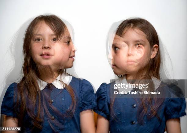 playing twin - look alike stock pictures, royalty-free photos & images