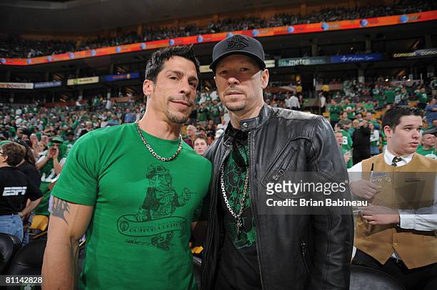 Singer Danny Wood and Actor/Singer Donnie Wahlberg watch the game between the Boston Celtics and the Cleveland Cavaliers in Game Seven of the Eastern...