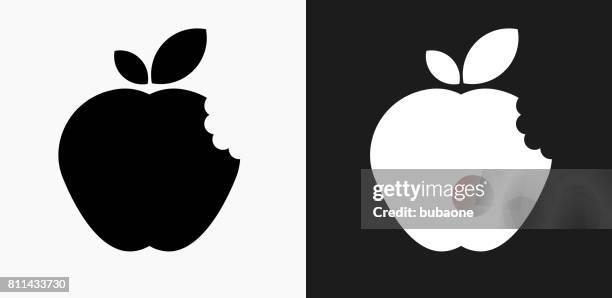 bitten apple icon on black and white vector backgrounds - juicy stock illustrations