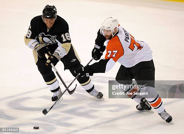 Marian Hossa of the Pittsburgh Penguins battles for the puck against Ryan Parent of the Philadelphia Flyers in game five of the Eastern Conference...