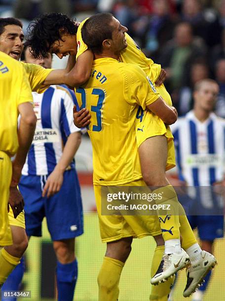 Villarreal CF?s Argentinian Guille Franco and Turkish Nihat embrace after scoring against Deportivo Coruna during their Spanish league football match...