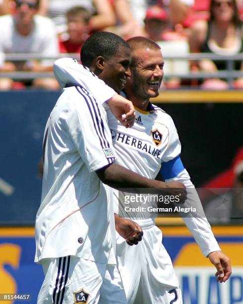 David Beckham and Edson Buddle of the Los Angeles Galaxy celebrate Buddle's goal against FC Dallas during the game at Pizza Hut Park on May 18, 2008...