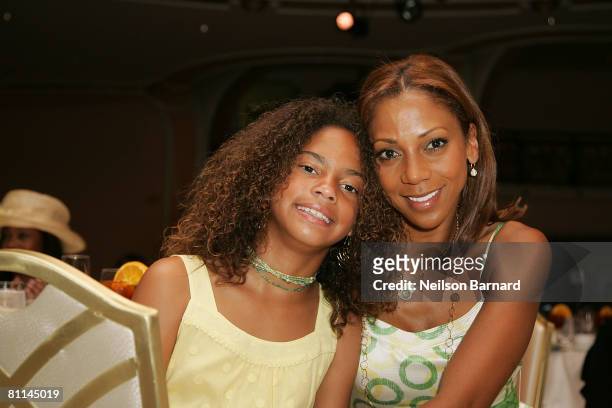 Actress Holly Robinson-Peete and daughter pose for a photograph at the "Victoria Rowell Steps Out For High Tea At Noon" event at the Beverly Hills...