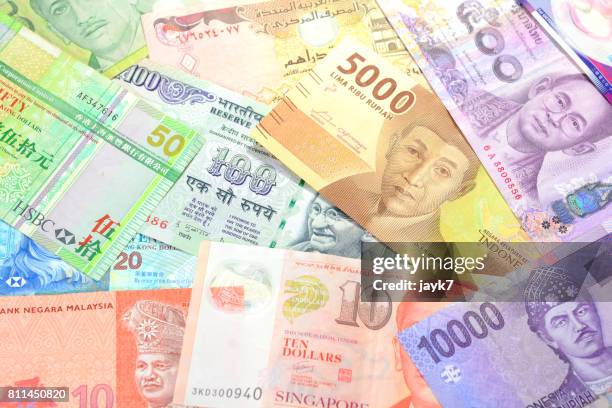 asian currencies - jayk7 currency stock pictures, royalty-free photos & images