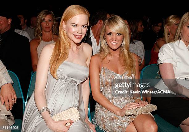 Actress Nicole Kidman and singer Carrie Underwood pose in the audience during the 43rd annual Academy Of Country Music Awards held at the MGM Grand...