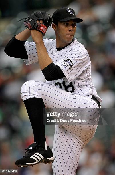 Starting pitcher Ubaldo Jimenez of the Colorado Rockies delivers against the Minnesota Twins during Interleague MLB action at Coors Field on May 16,...