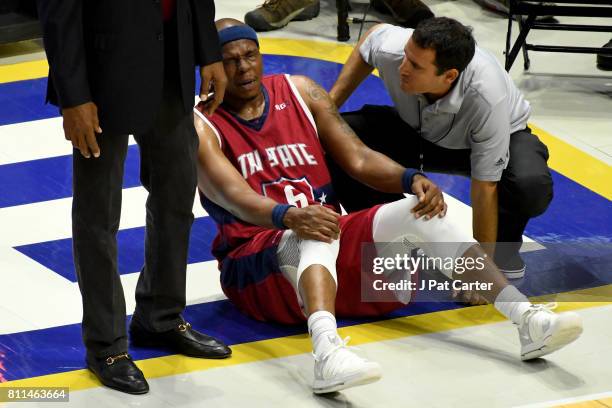 Bonzi Wells of Tri-State is examined after being injured during the game against the Killer 3s during week three of the BIG3 three on three...