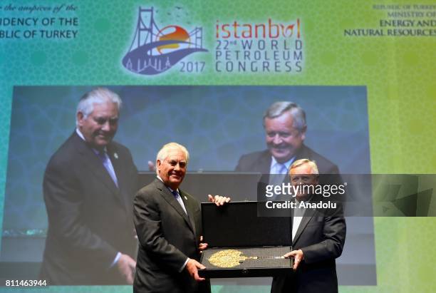 Secretary of State Rex Tillerson receives the highest recognition of the World Petroleum Council , the Dewhurst Award, from Jozsef Laszlo Toth ,...