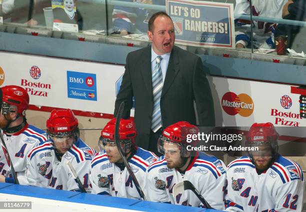 Head Coach Peter DeBoer of the Kitchener Rangers shouts out some orders to his players against the Spokane Chiefs in a Memorial Cup round robin game...