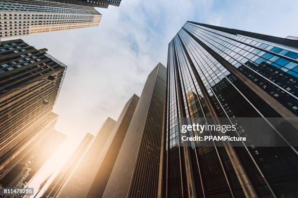 manhattan office building from below - skyscrapers stock pictures, royalty-free photos & images