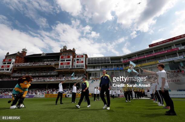 The umpires Paul Baldwin and David Millns take to the field at the start of play in the NatWest T20 Blast match at The Kia Oval on July 9, 2017 in...