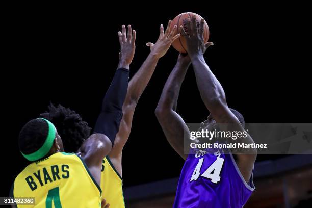 Ivan Johnson of the Ghost Ballers attempts a shot while being guarded by Josh Childress and Derrick Byars of the Ball Hogs during week three of the...
