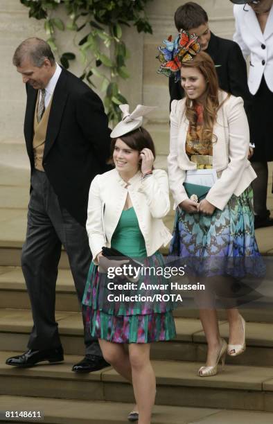 Prince Andrew, Duke of York leaves with his daughters Princess Eugenie and Princess Beatrice following the wedding of Peter Phillips and Autumn Kelly...