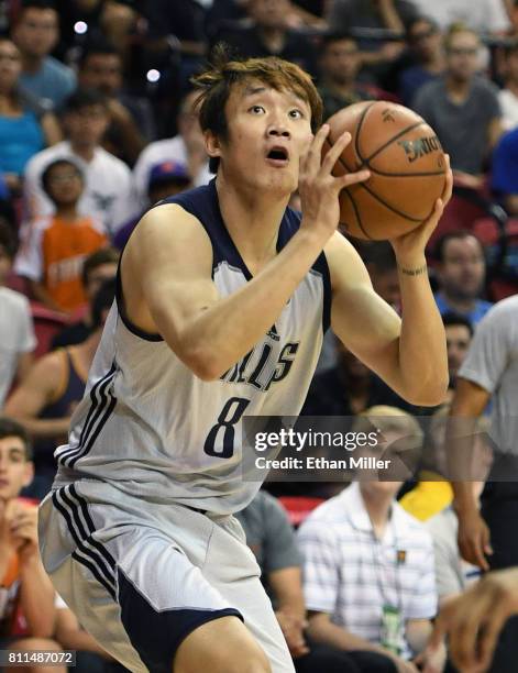 Ding Yanyuhang of the Dallas Mavericks looks to shoot against the Phoenix Suns during the 2017 Summer League at the Thomas & Mack Center on July 9,...