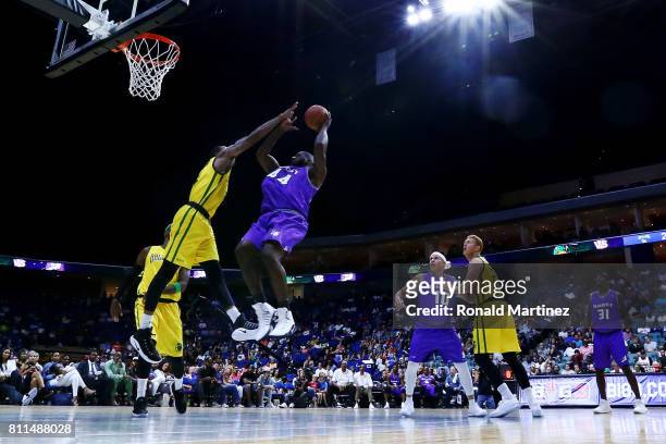 Ivan Johnson of the Ghost Ballers attempts a shot while being guarded by Rasual Butler of the Ball Hogs during week three of the BIG3 three on three...