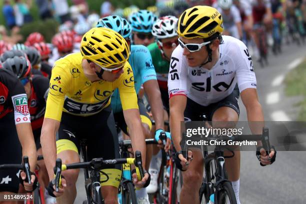 Christopher Froome of Great Britain riding for Team Sky in the leader's jersey and Geraint Thomas of Great Britain riding for Team Sky ride talk...