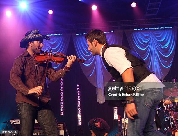 Musicians David Pichette and Brad Mates of Emerson Drive perform during the 43rd annual Academy Of Country Music Awards All-Star Jam held at the MGM...