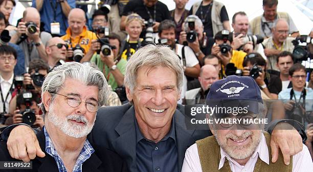 Producer George Lucas, actor Harrison Ford and director Steven Spielberg pose during a photocall for their film 'Indiana Jones and the Kingdom of the...