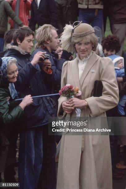 Princess Diana , wearing a John Boyd hat and a tweed coat by Caroline Charles, during a visit to St. Davids, Pembrokeshire, November 1981.