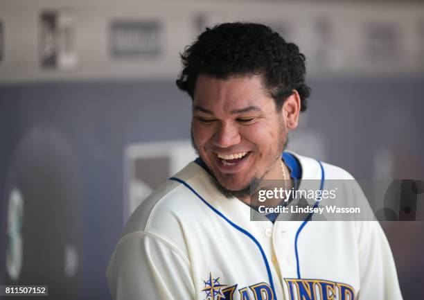 Felix Hernandez of the Seattle Mariners smiles in the dugout in the sixth inning after being taken out of the game, giving up only two hits to the...