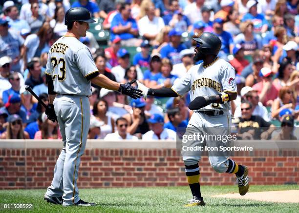 Pittsburgh Pirates left fielder Josh Harrison and Pittsburgh Pirates third baseman David Freese celebrate the run during the game between the...