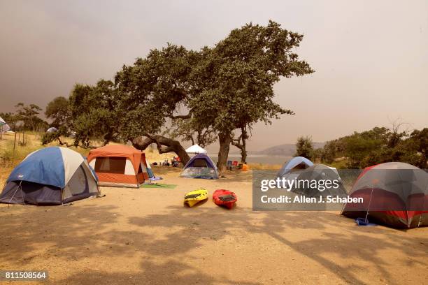 Tents, food and personal belongs remain abandoned after campers were evacuated from the fast-moving Whittier Fire in the Los Padres National Forest...