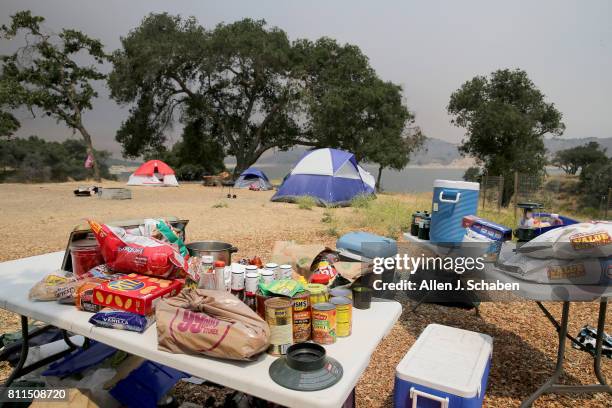 Tents, food and personal belongs remain abandoned after campers were evacuated from the fast-moving Whittier Fire in the Los Padres National Forest...