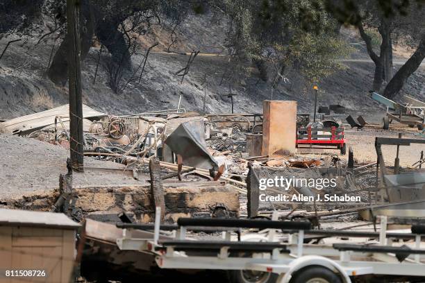 The remains of a structure and boats scorched by the Whittier Fire along SR-154 in the Los Padres National Forest near Lake Cachuma, Santa Barbara...