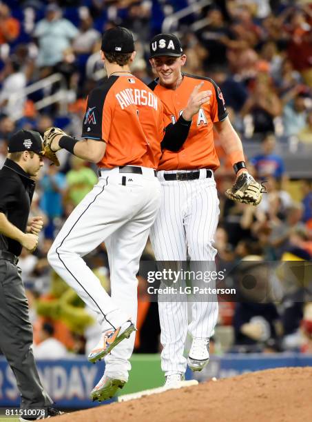 Brian Anderson and Ryan McMahon of Team USA celebrate after defeating the World Team in the SirusXM All-Star Futures Game at Marlins Park on Sunday,...