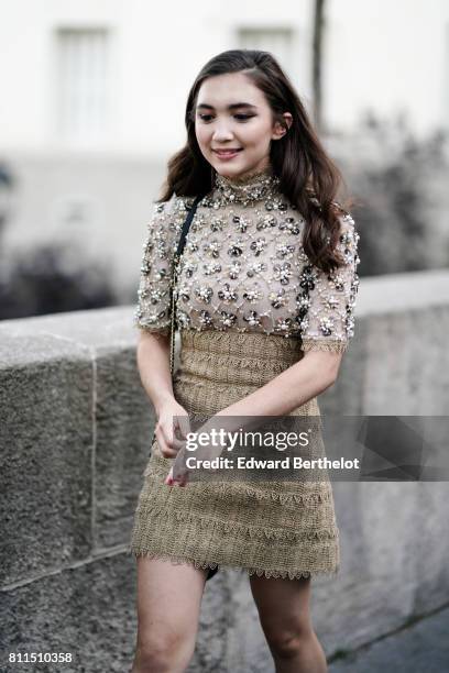 Rowan Blanchard wears a lace mesh dress with tweed, outside the launch party for Chanel's new perfume 'Gabrielle', during Paris Fashion Week - Haute...