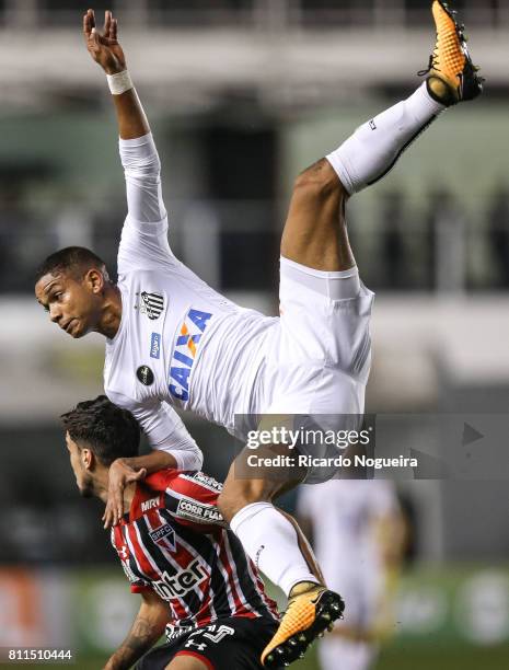 David Braz of Santos battles for the ball with Marcinho of Sao Paulo during the match between Santos and Sao Paulo as a part of Campeonato Brasileiro...