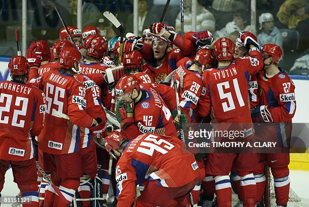 Russia celebrates at the end of the game after winniing 4-0 against Finland during the semifinals of the 2008 IIHF World Hockey Championships at the...