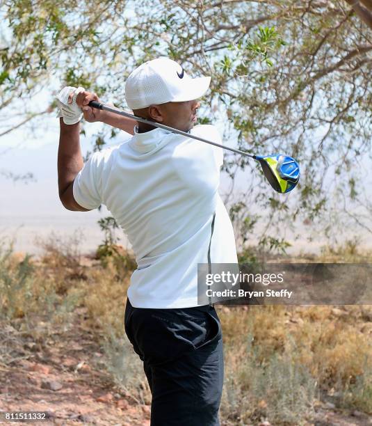 Professional basketball player Gerald Henderson Jr. Hits a tee shot during the Coach Woodson Las Vegas Invitational at Cascata Golf Club on July 9,...