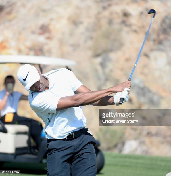 Professional basketball player Gerald Henderson Jr. Hits an approach shot from the fairway during the Coach Woodson Las Vegas Invitational at Cascata...