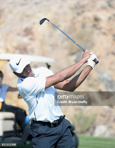 Professional basketball player Gerald Henderson Jr. Hits an approach shot from the fairway during the Coach Woodson Las Vegas Invitational at Cascata...